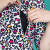 A close up of the Rainbow Leopard Midi Breastfeeding Dress by Stylish Mum. The photo is showing the breastfeeding access via an open zip on the nursing dress. 
